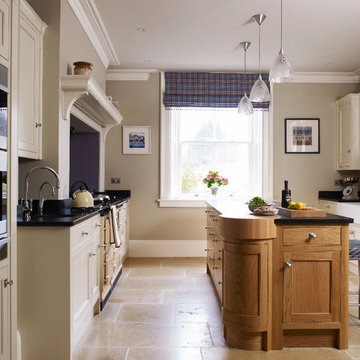 Classic painted bespoke kitchen with curved oak island & pantry