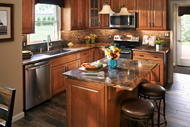 Inspiration for a timeless eat-in kitchen remodel in Philadelphia with medium tone wood cabinets and an island