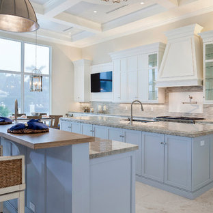 Large transitional u-shaped open plan kitchen in Miami with an undermount sink, recessed-panel cabinets, purple cabinets, marble benchtops, multi-coloured splashback, subway tile splashback, stainless steel appliances, porcelain floors, multiple islands, beige floor and beige benchtop.