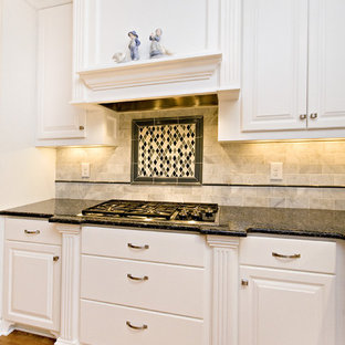 Large traditional eat-in kitchen ideas - Eat-in kitchen - large traditional l-shaped eat-in kitchen idea in Raleigh with an undermount sink, raised-panel cabinets, white cabinets, granite countertops, white backsplash, subway tile backsplash, white appliances and two islands