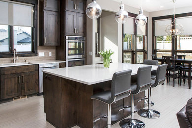 Example of a mid-sized trendy l-shaped light wood floor open concept kitchen design in Other with an undermount sink, shaker cabinets, dark wood cabinets, quartz countertops, beige backsplash, matchstick tile backsplash, stainless steel appliances and an island