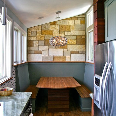Inspiration for a mid-sized contemporary u-shaped medium tone wood floor eat-in kitchen remodel in Austin with an undermount sink, shaker cabinets, gray cabinets, stainless steel appliances, granite countertops, multicolored backsplash and glass tile backsplash