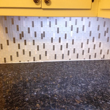 Close up of Blue Pearl against white and steel backsplash