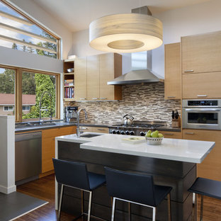 Eat-in kitchen - mid-sized contemporary l-shaped medium tone wood floor eat-in kitchen idea in San Francisco with matchstick tile backsplash, stainless steel appliances, brown backsplash, medium tone wood cabinets, flat-panel cabinets, an undermount sink and an island