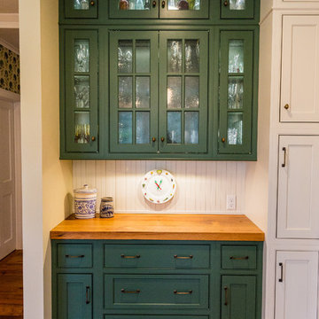  A farmhouse kitchen with green cabinets
