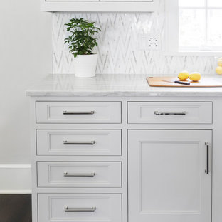 Large transitional open concept kitchen photos - Inspiration for a large transitional l-shaped dark wood floor and brown floor open concept kitchen remodel in New York with a single-bowl sink, shaker cabinets, light wood cabinets, quartzite countertops, multicolored backsplash, mosaic tile backsplash, stainless steel appliances and an island