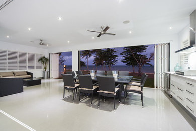 This is an example of a contemporary dining room in Cairns.