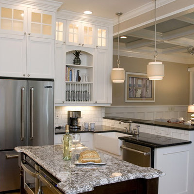 Open concept kitchen - coastal u-shaped open concept kitchen idea in Raleigh with stainless steel appliances, a farmhouse sink, recessed-panel cabinets, white cabinets, granite countertops, white backsplash and subway tile backsplash