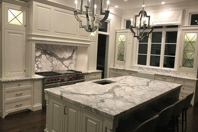 Eat-in kitchen - mid-sized l-shaped dark wood floor eat-in kitchen idea in Raleigh with a single-bowl sink, marble countertops, white backsplash, marble backsplash, stainless steel appliances, an island and white countertops