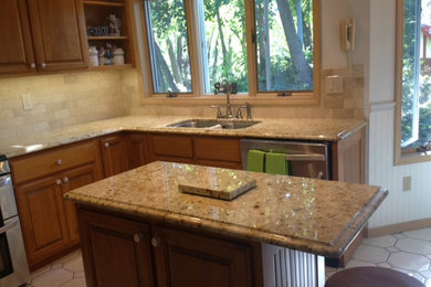 Example of a kitchen design in Chicago with granite countertops