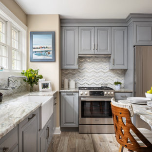 Small traditional l-shaped separate kitchen in New York with a farmhouse sink, raised-panel cabinets, blue cabinets, quartzite benchtops, multi-coloured splashback, glass sheet splashback, stainless steel appliances, porcelain floors, a peninsula, multi-coloured floor and multi-coloured benchtop.
