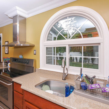 Colorful, Contemporary Kitchen with New Sliding Window and Circle-Top Window