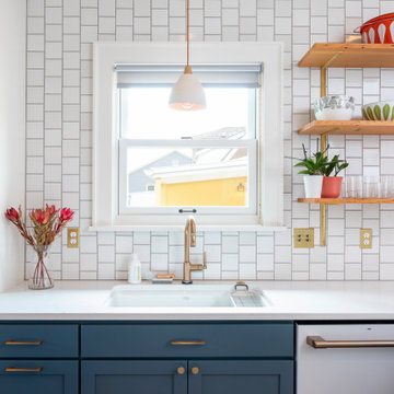 Colorful Vintage-Inspired Kitchen with Brass Accents