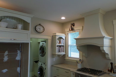 Example of a mid-sized cottage u-shaped dark wood floor kitchen pantry design in Columbus with an undermount sink, beaded inset cabinets, light wood cabinets, granite countertops, beige backsplash, ceramic backsplash, stainless steel appliances and an island