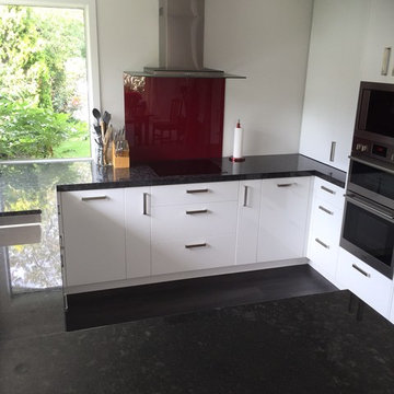 Compact kitchen with Steel Grey Granite benches and gloss white cabinetry