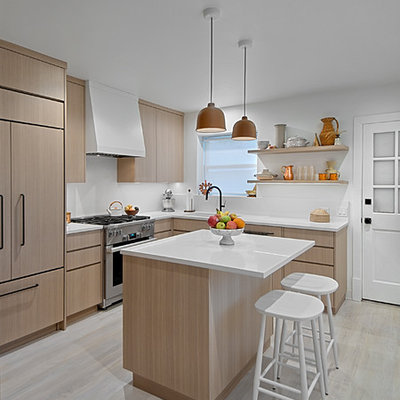 Kitchen - small contemporary l-shaped light wood floor and gray floor kitchen idea in Chicago with an undermount sink, flat-panel cabinets, light wood cabinets, quartz countertops, white backsplash, stone slab backsplash, stainless steel appliances, an island and white countertops