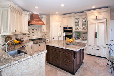 Open concept kitchen - large traditional u-shaped beige floor open concept kitchen idea in San Francisco with a double-bowl sink, raised-panel cabinets, white cabinets, quartzite countertops, multicolored backsplash, ceramic backsplash, stainless steel appliances and an island