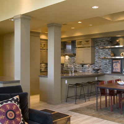 Example of an eclectic u-shaped open concept kitchen design in Portland with shaker cabinets and beige cabinets