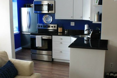 Small l-shaped kitchen photo in DC Metro with blue backsplash