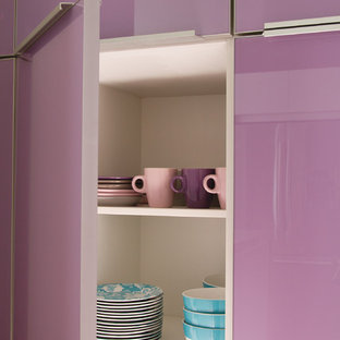 Inspiration for a mid-sized contemporary l-shaped open plan kitchen in Houston with a double-bowl sink, flat-panel cabinets, medium wood cabinets, solid surface benchtops, stainless steel appliances, ceramic floors and with island.