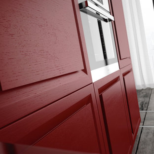 Mid-sized contemporary kitchen pantry photos - Kitchen pantry - mid-sized contemporary single-wall ceramic tile kitchen pantry idea in San Diego with a double-bowl sink, flat-panel cabinets, red cabinets, stainless steel countertops, metallic backsplash, metal backsplash, paneled appliances and a peninsula