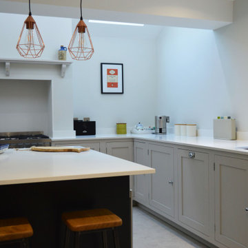 Contemporary cream handmade kitchen with mantel shelf, statement island and pend