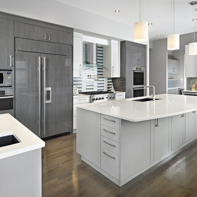 Trendy kitchen photo in Edmonton with paneled appliances