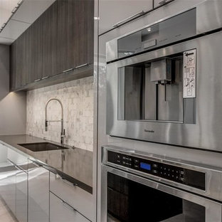 Contemporary open concept kitchen ideas - Example of a trendy l-shaped travertine floor and gray floor open concept kitchen design in Houston with flat-panel cabinets, gray cabinets, marble countertops, gray backsplash, marble backsplash, stainless steel appliances, two islands and gray countertops