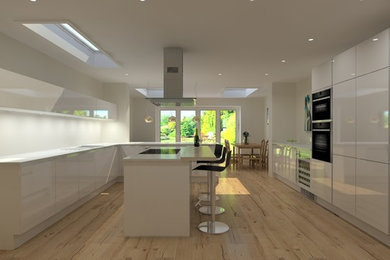 This is an example of a large contemporary l-shaped kitchen/diner in Wiltshire with flat-panel cabinets, white cabinets, quartz worktops, black appliances, light hardwood flooring, an island and white worktops.