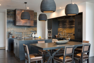Trendy dark wood floor eat-in kitchen photo in Orlando with a farmhouse sink, gray cabinets, stainless steel appliances and an island