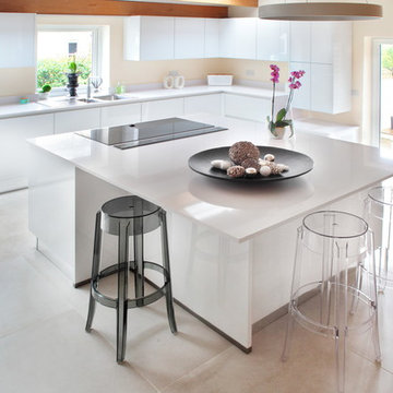 Contemporary handle-less white kitchen with modern features