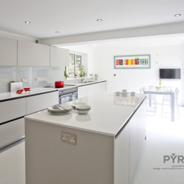 Contemporary handleless kitchen in light grey