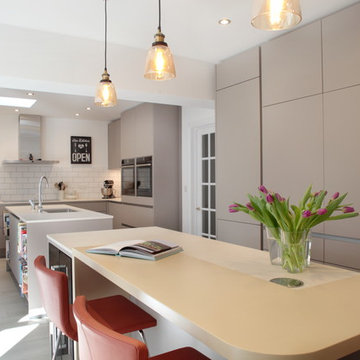 Contemporary handleless kitchen with two islands and breakfast bar