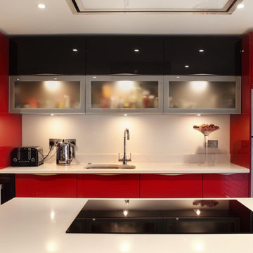 Contemporary high gloss red kitchen with frosted glass cabinets