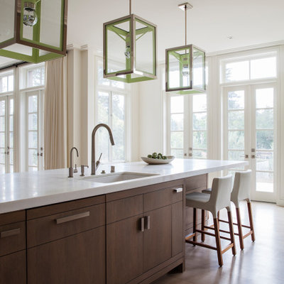 Kitchen - large contemporary medium tone wood floor and brown floor kitchen idea in San Francisco with an undermount sink, flat-panel cabinets, medium tone wood cabinets, an island and white countertops