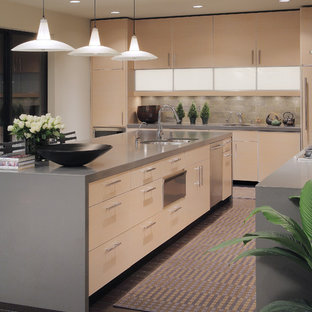 Contemporary kitchen inspiration - Example of a trendy kitchen design in Phoenix with flat-panel cabinets and gray backsplash