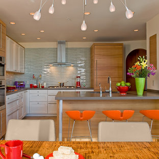 Design ideas for a contemporary l-shaped eat-in kitchen in Boston with panelled appliances, an undermount sink, shaker cabinets, white cabinets, quartz benchtops, blue splashback and glass tile splashback.