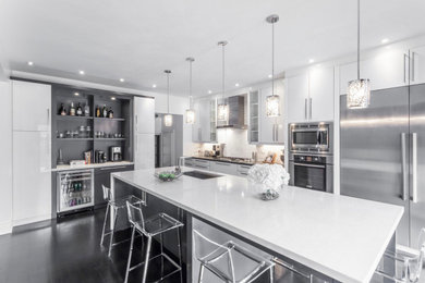Large trendy l-shaped dark wood floor and gray floor eat-in kitchen photo in Toronto with a single-bowl sink, flat-panel cabinets, white cabinets, quartz countertops, white backsplash, marble backsplash, stainless steel appliances, an island and gray countertops