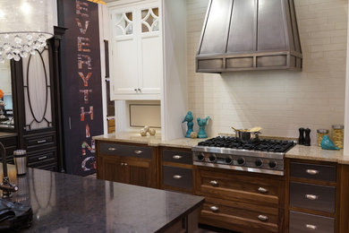 Example of a small trendy u-shaped eat-in kitchen design in Tampa with shaker cabinets, dark wood cabinets, white backsplash, subway tile backsplash, stainless steel appliances and an island