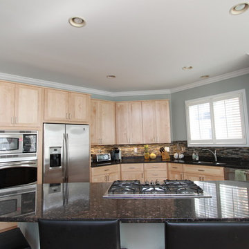 Contemporary Kitchen in Natural Maple with Black Granite Counters in McLean, VA
