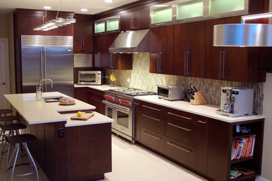 Example of a mid-sized trendy l-shaped porcelain tile and white floor eat-in kitchen design in Chicago with a double-bowl sink, flat-panel cabinets, dark wood cabinets, solid surface countertops, multicolored backsplash, matchstick tile backsplash, stainless steel appliances and an island