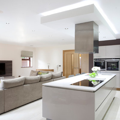 Open concept kitchen - contemporary open concept kitchen idea in Belfast with an undermount sink, flat-panel cabinets and white cabinets