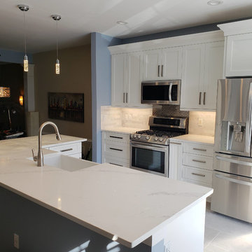Contemporary Kitchen remodel with high end marble, steel, and quartz.