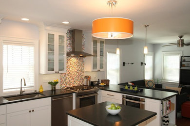 Example of a large trendy u-shaped medium tone wood floor open concept kitchen design in Milwaukee with an undermount sink, shaker cabinets, white cabinets, granite countertops, multicolored backsplash, porcelain backsplash, stainless steel appliances and an island