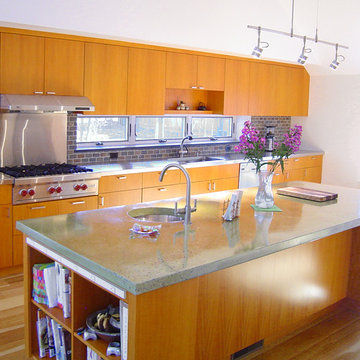 Contemporary Kitchen with Concrete and Steel Counters
