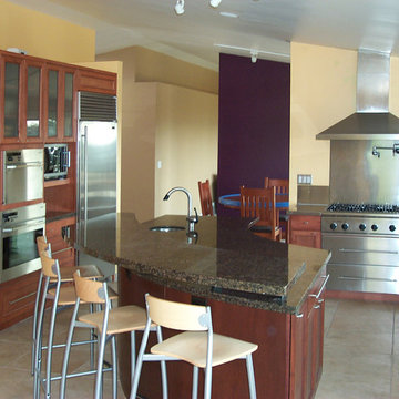 Contemporary Kitchen with Curved Bar and Plum Accent Wall