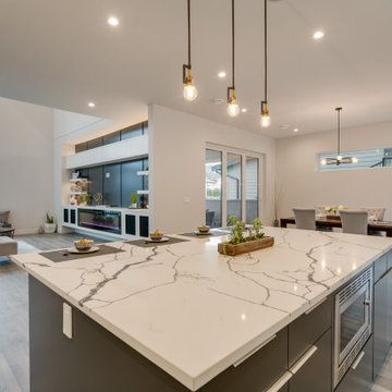 Contemporary Kitchen with Huge Marble Quartz Counter Top Island.