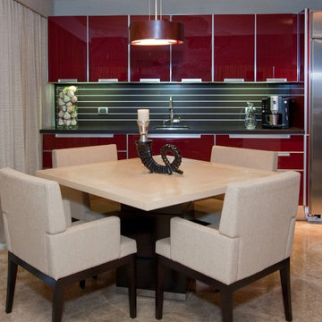 Contemporary Kitchen with Red Glass Cabinetry