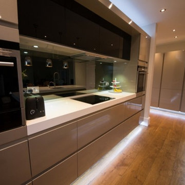 Contemporary Kitchen with thick white worktops