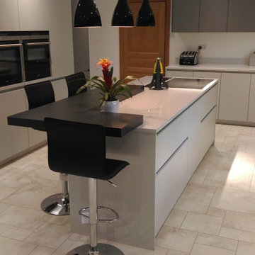 Contemporary, matt grey kitchen with island & breakfast bar